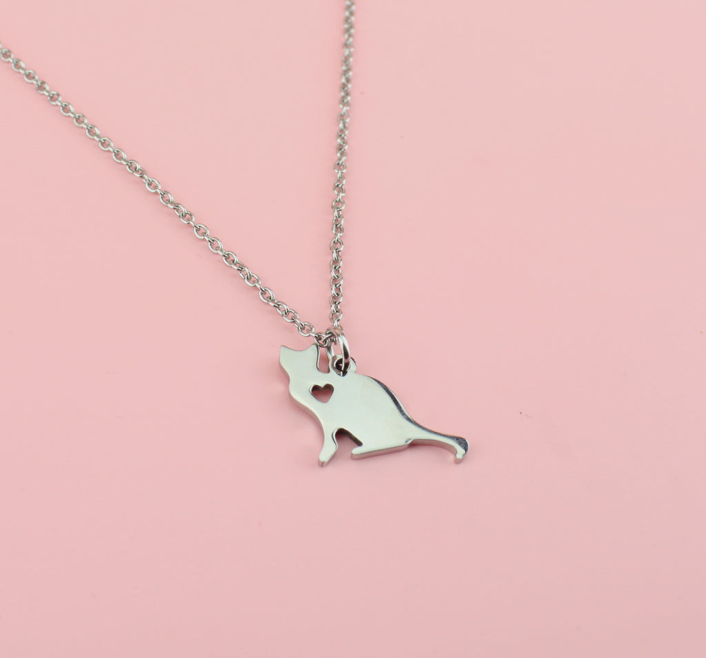 Cat pendant with cut out heart on a stainless steel chain