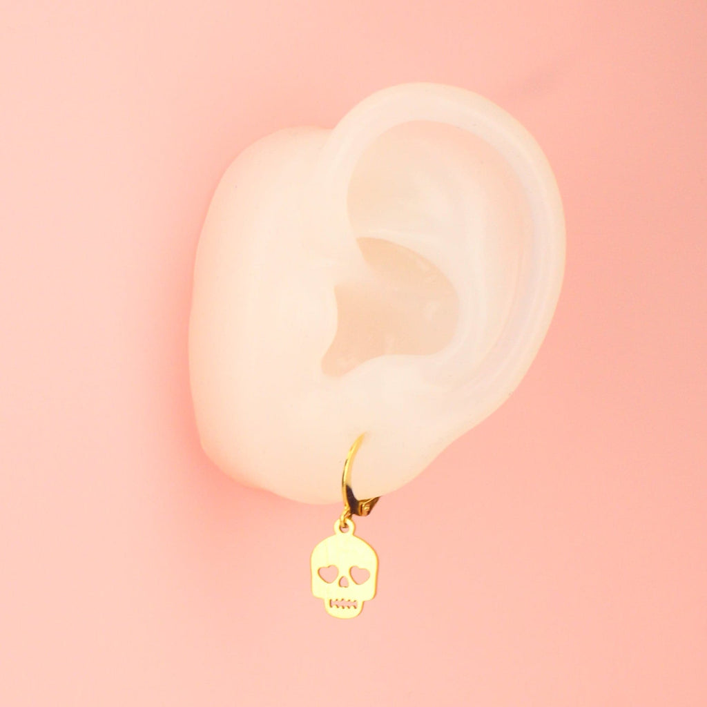 Ear wearing Lovely Bones Skull Earrings (Gold Plated)