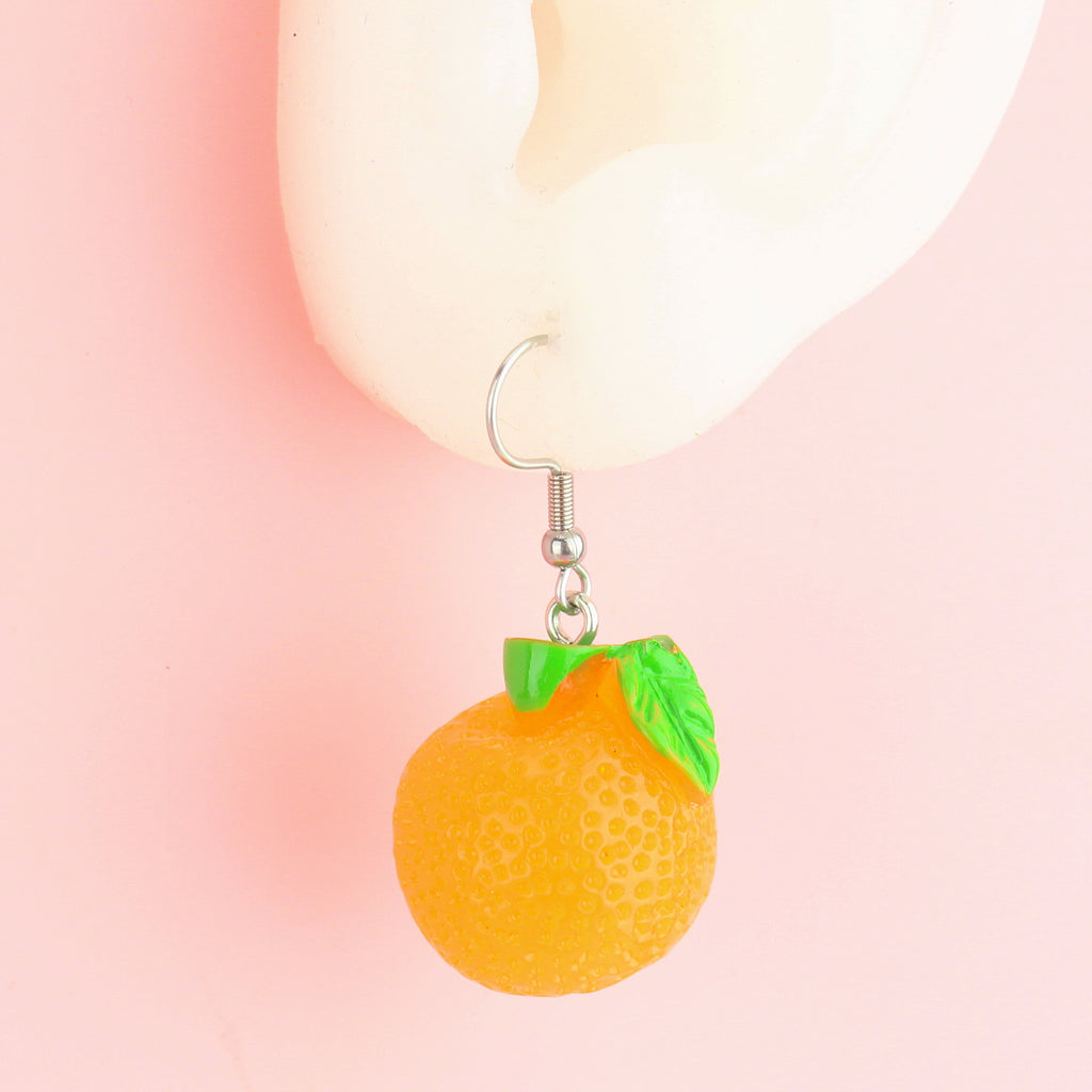 Ear wearing Orange fruit charms on stainless steel earwires