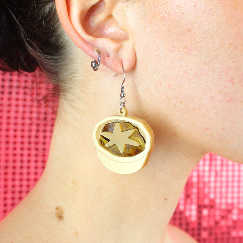Model wearing Mince pie earrings