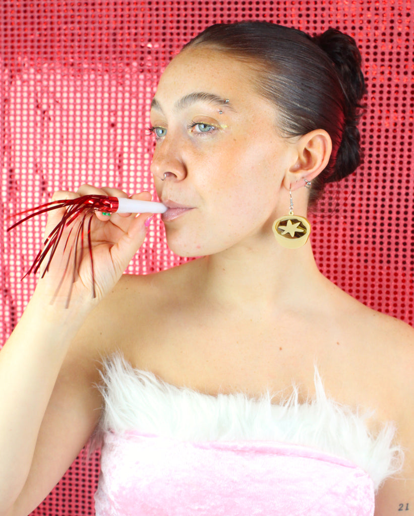 Model wearing Mince pie earrings
