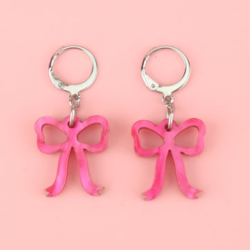 Mini pink marble bow charms on stainless steel huggie hoops