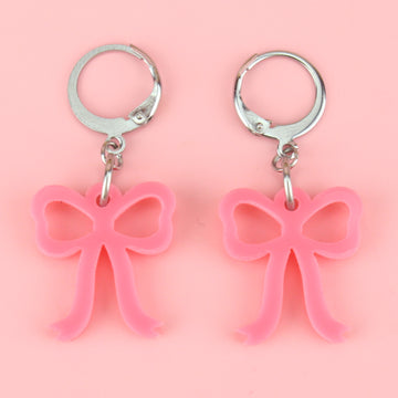 Mini rose pink bow charms on stainless steel huggie hoops