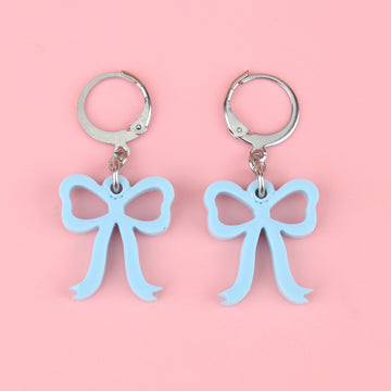 Baby blue bow charms on stainless steel huggie hoops