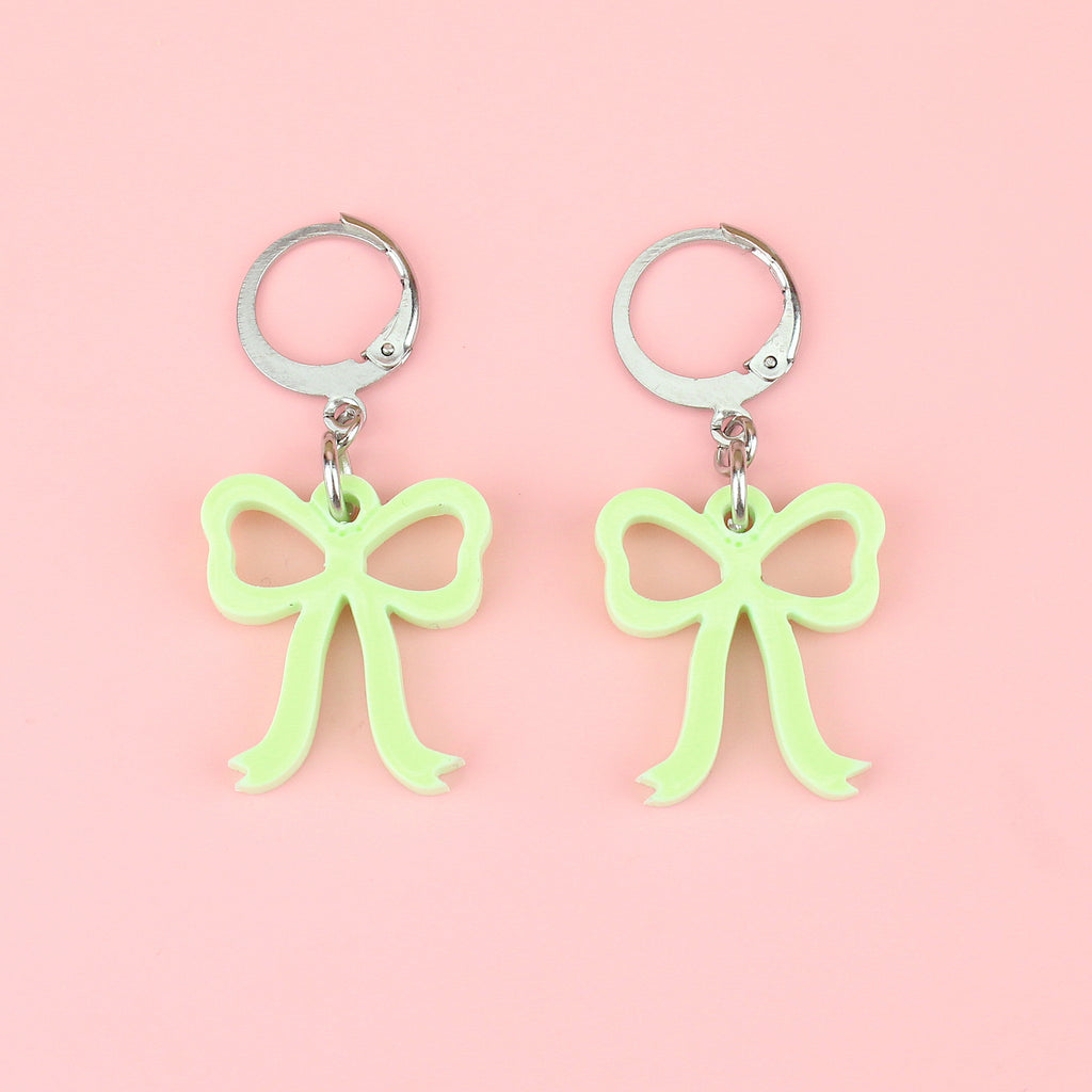 Green bow charms on stainless steel huggie hoops