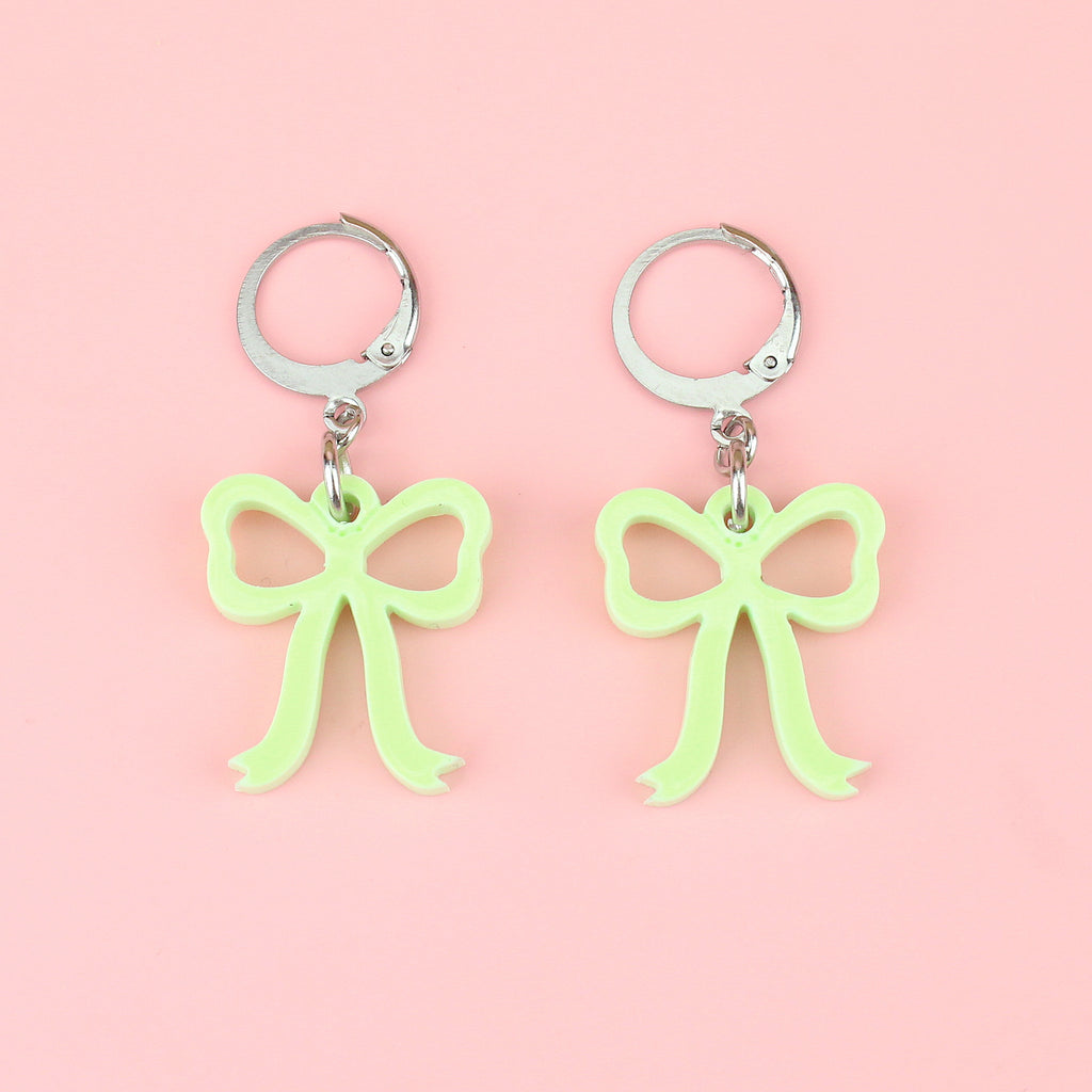 Green bow charms on stainless steel huggie hoops
