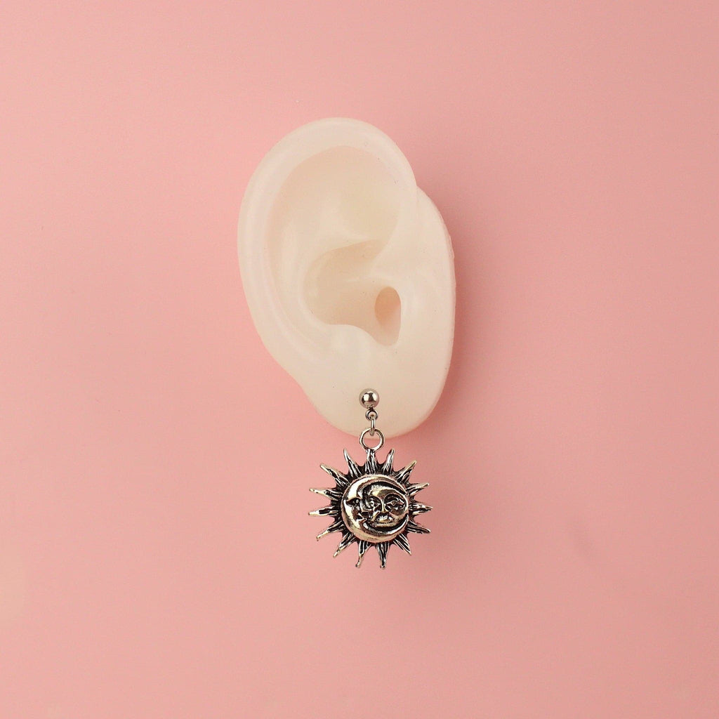 Ear wearing Moon & Sun Stud Earrings