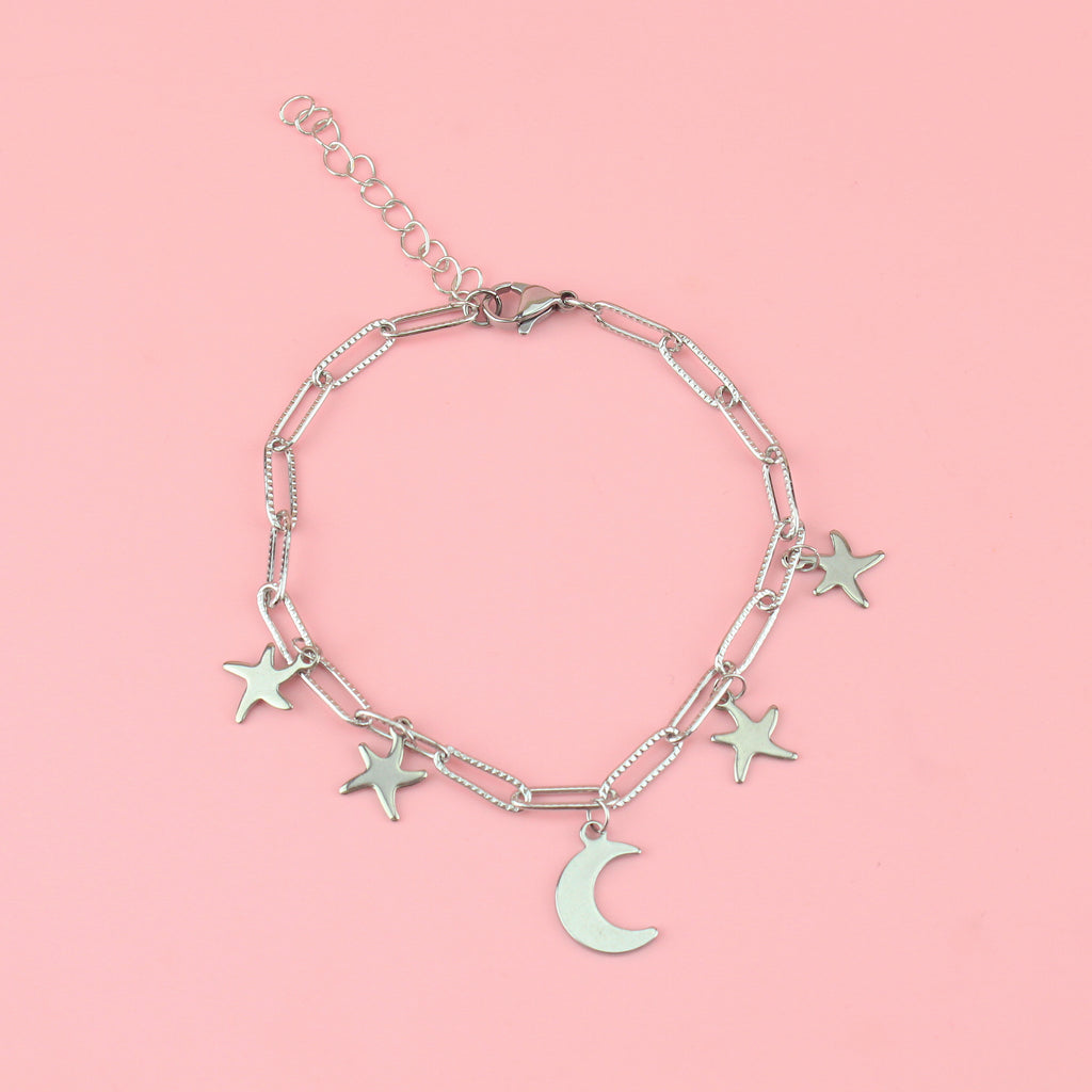 Oval link chain with stainless steel star and moon charms on