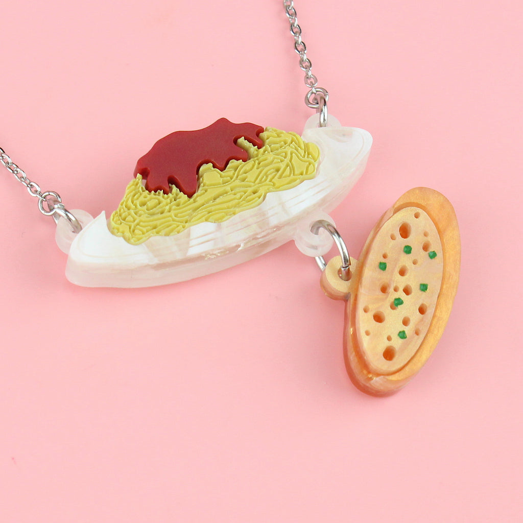 Spaghetti bolognese and garlic bread pendants on a stainless steel chain