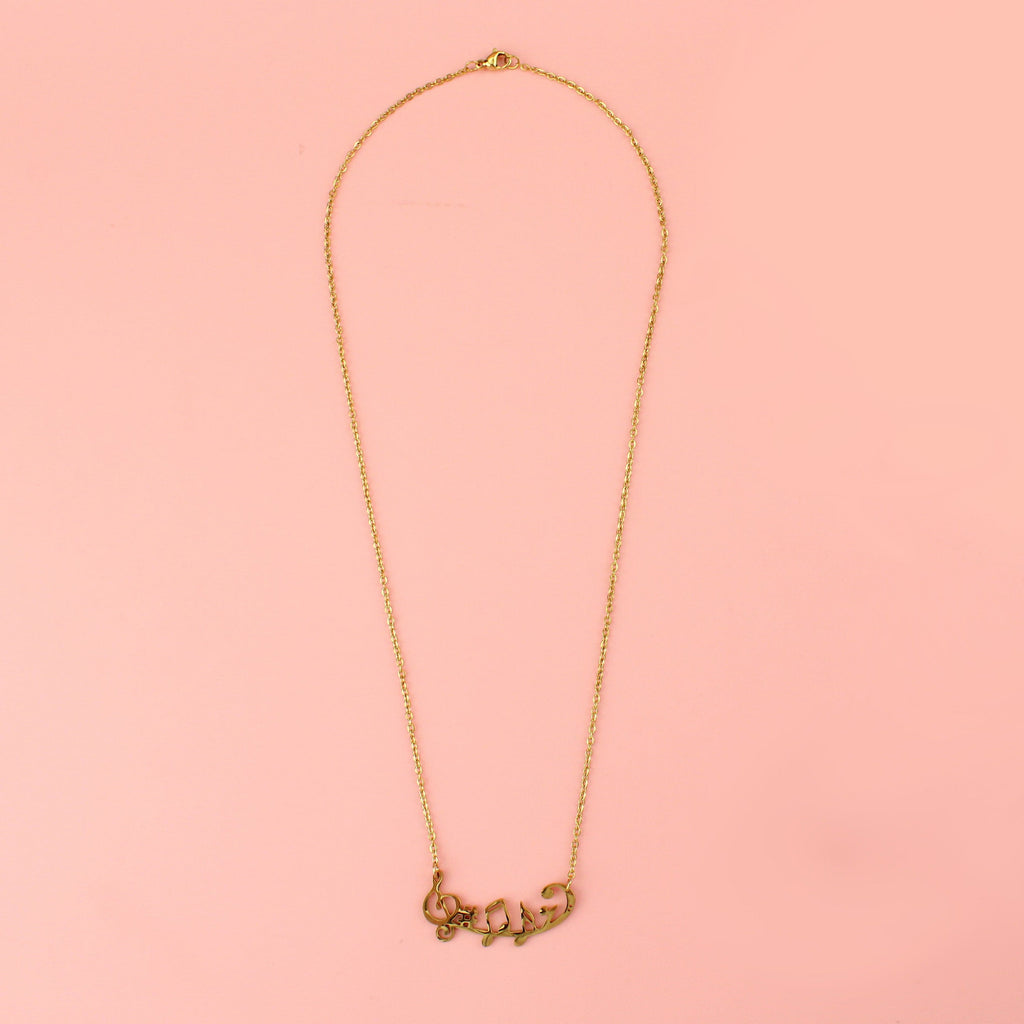 Gold plated stainless steel necklace with music notes including a treble clef, sharp and a semiquaver