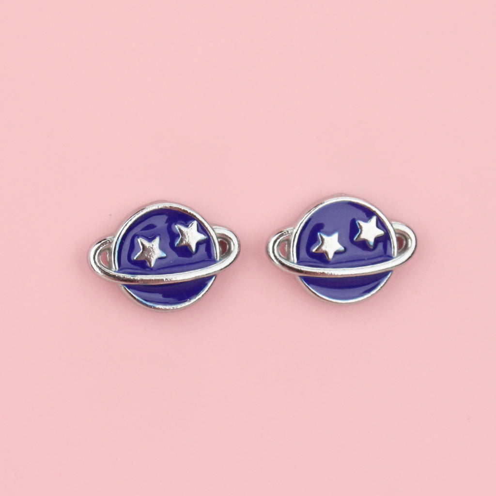 stainless steel neptune planet stud earrings with blue enamel and two stars on the top half of the planet