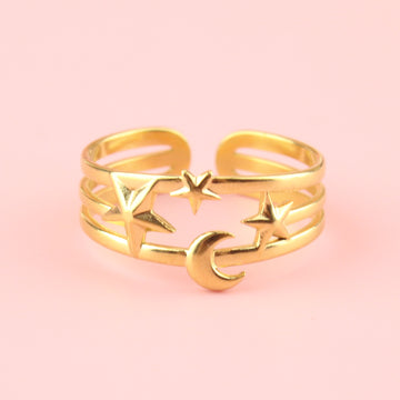 Triple ring effect made with gold plated stainless steel with a large star on the left, small in the middle and medium sized star on the right with a moon beneath the middle star