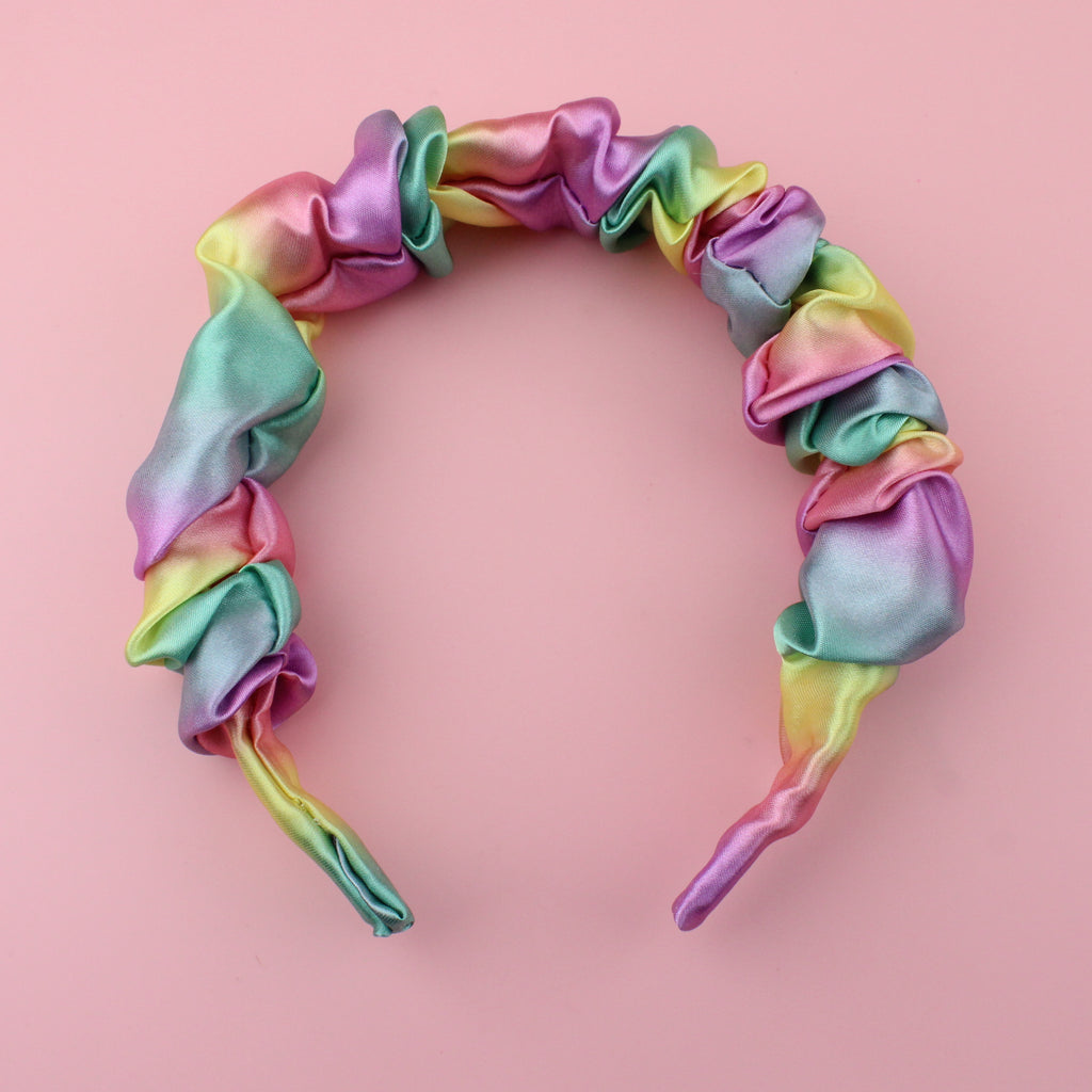 Satin scrunchie style headband with pastel yellow, pink, purple, green and blue colours