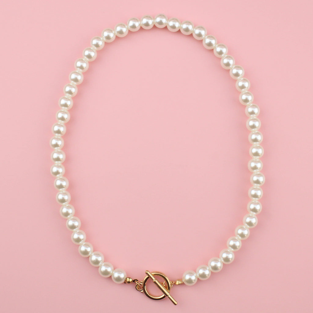 Plastic pearl necklace with a gold zinc alloy toggle clasp