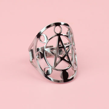 stainless steel ring with an oval shaped front featuring a cut out pentacle moon phase design