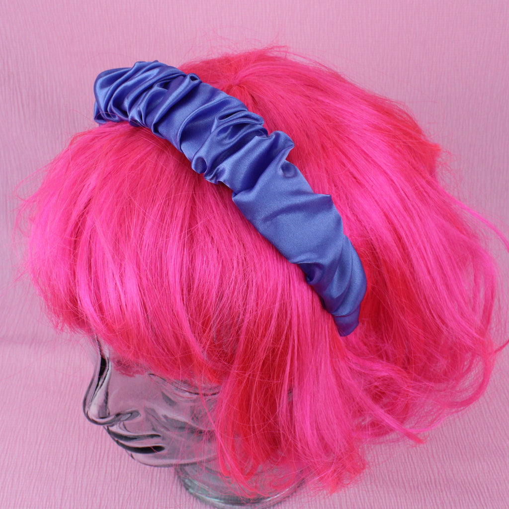 Periwinkle coloured scrunchie style headband shown on a wig for scale