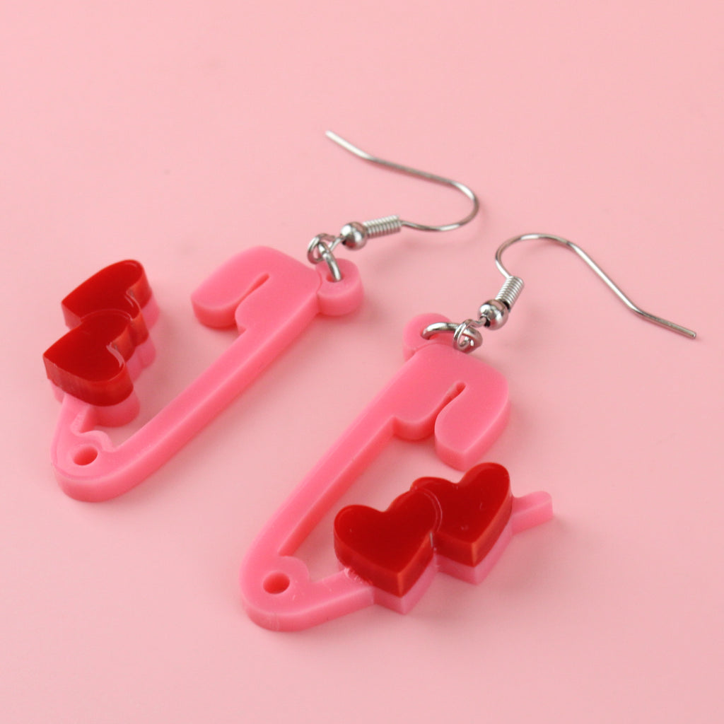 open safety pin charms adorned with two charming red hearts on stainless steel earwires