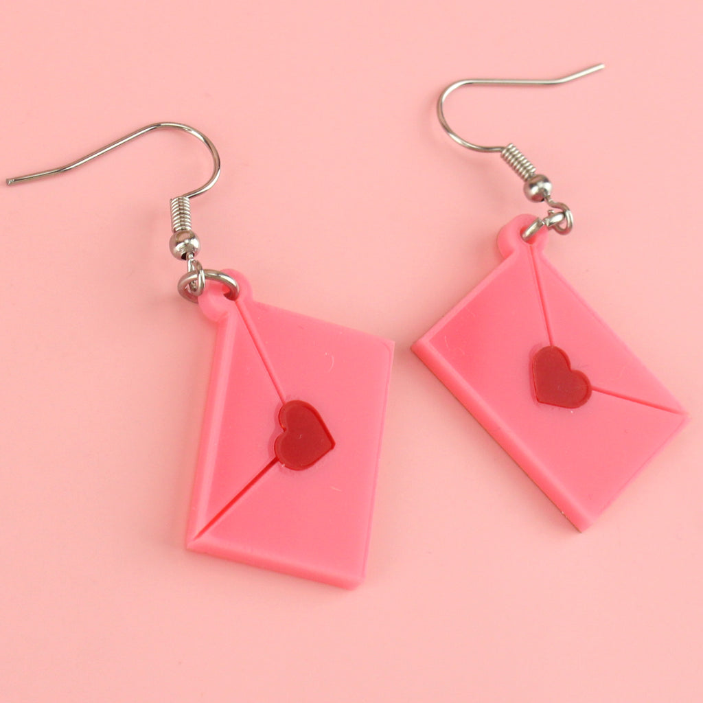 acrylic pink envelopes, each sealed with a red heart, and attached to stainless steel earwires