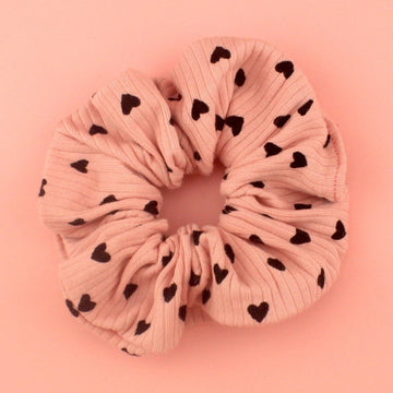 Ribbed pink scrunchie with black hearts