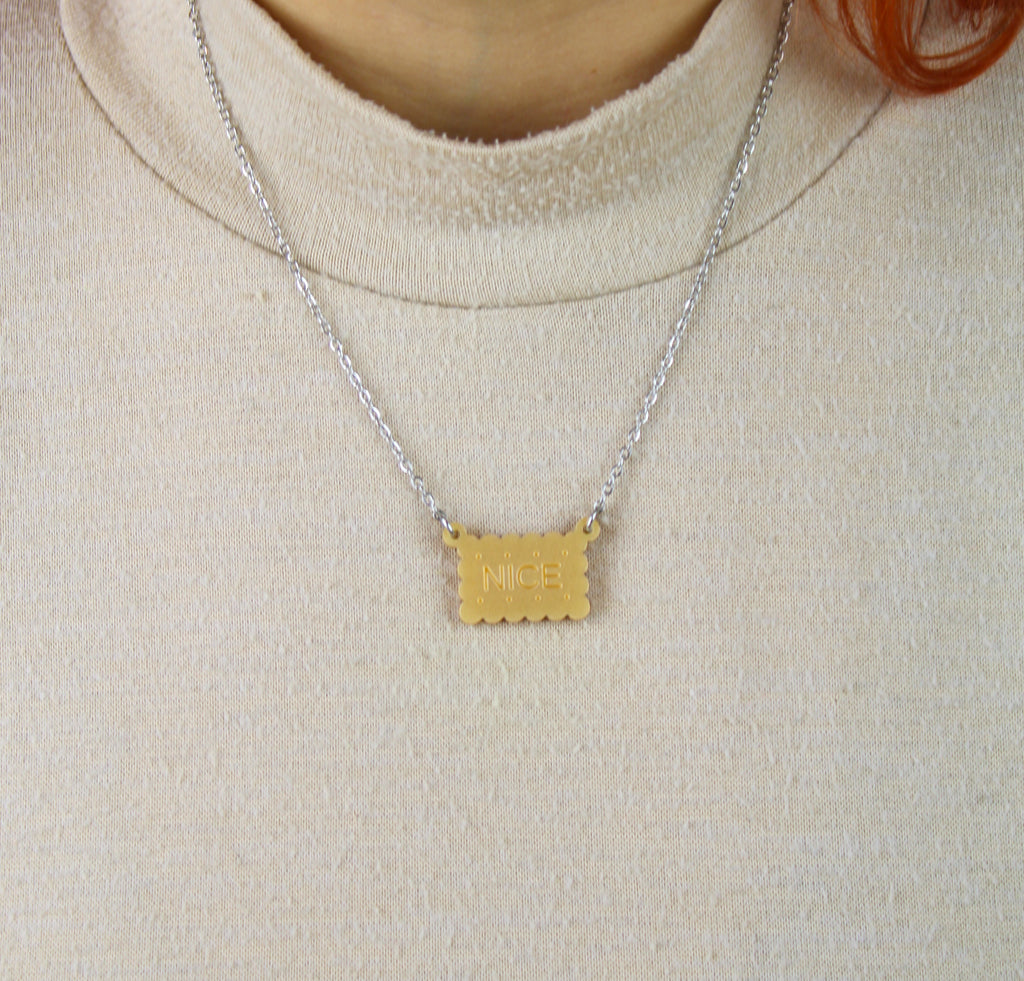 Necklace with a nice biscuit pendant worn by model