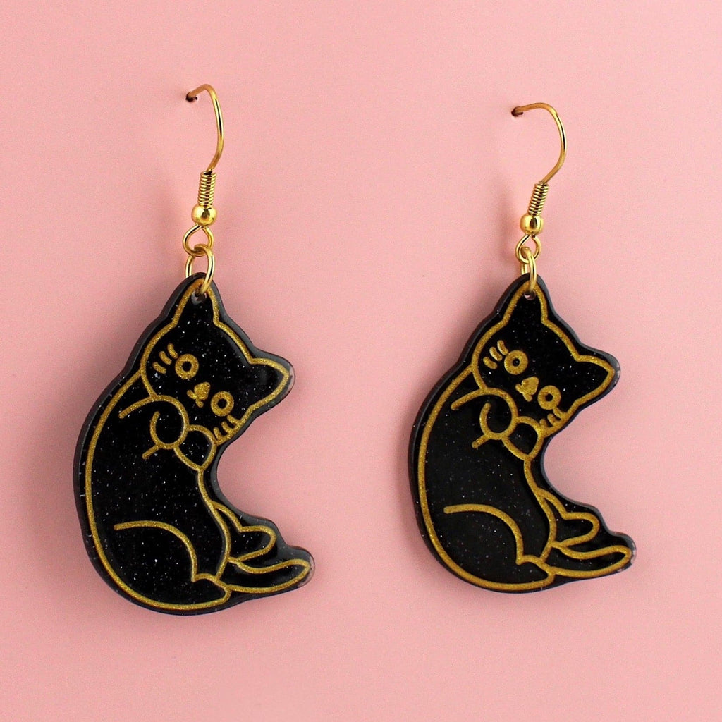 Black glitter cat earrings with gold outlines on gold plated stainless steel earwires 