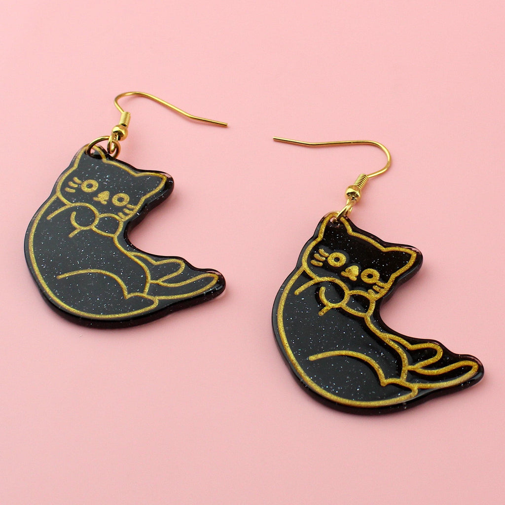 Black glitter cat earrings with gold outlines on gold plated stainless steel earwires 