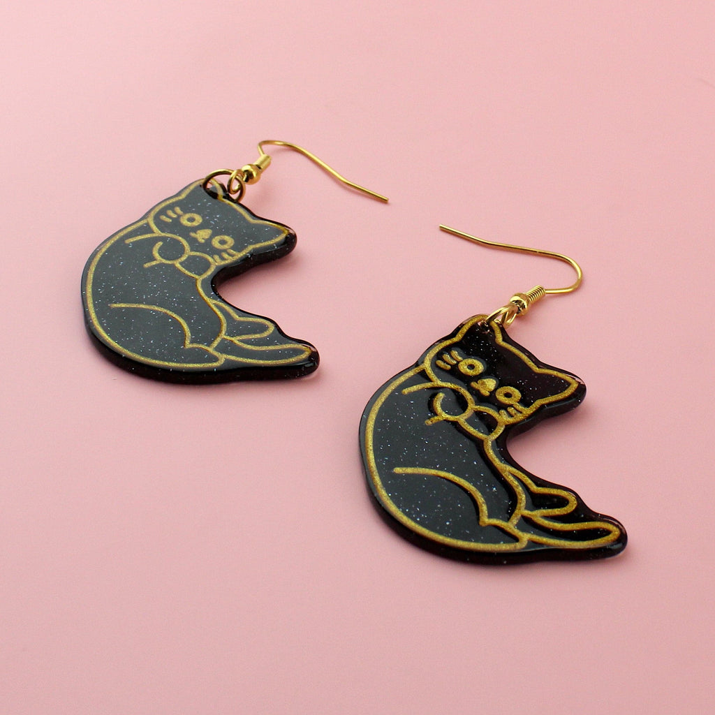 Black glitter cat earrings with gold outlines on gold plated stainless steel earwires 