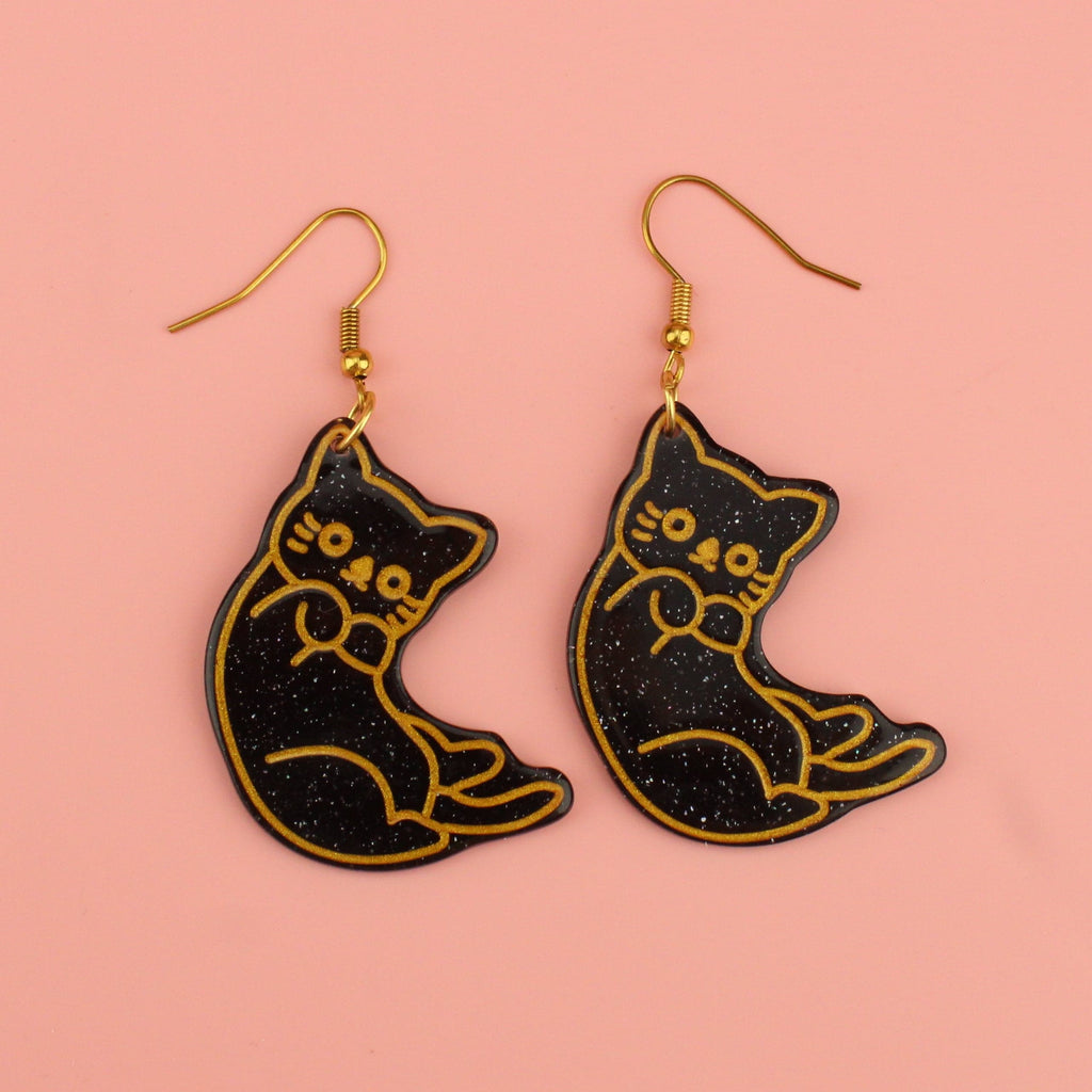 Black glitter cat earrings with gold outlines on gold plated stainless steel earwires 