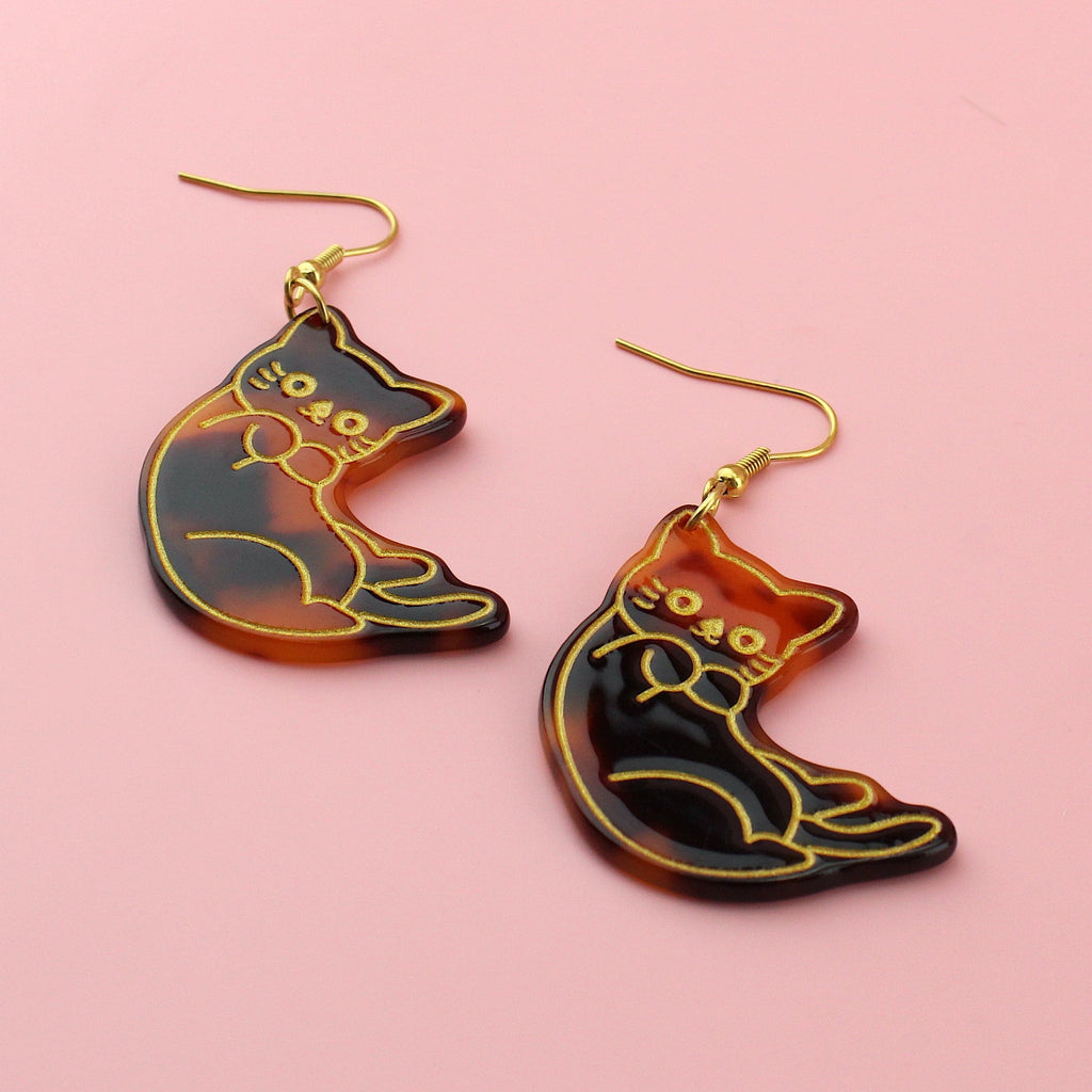 Resin tortoiseshell cat charms with a gold outline on gold plated stainless steel earwires