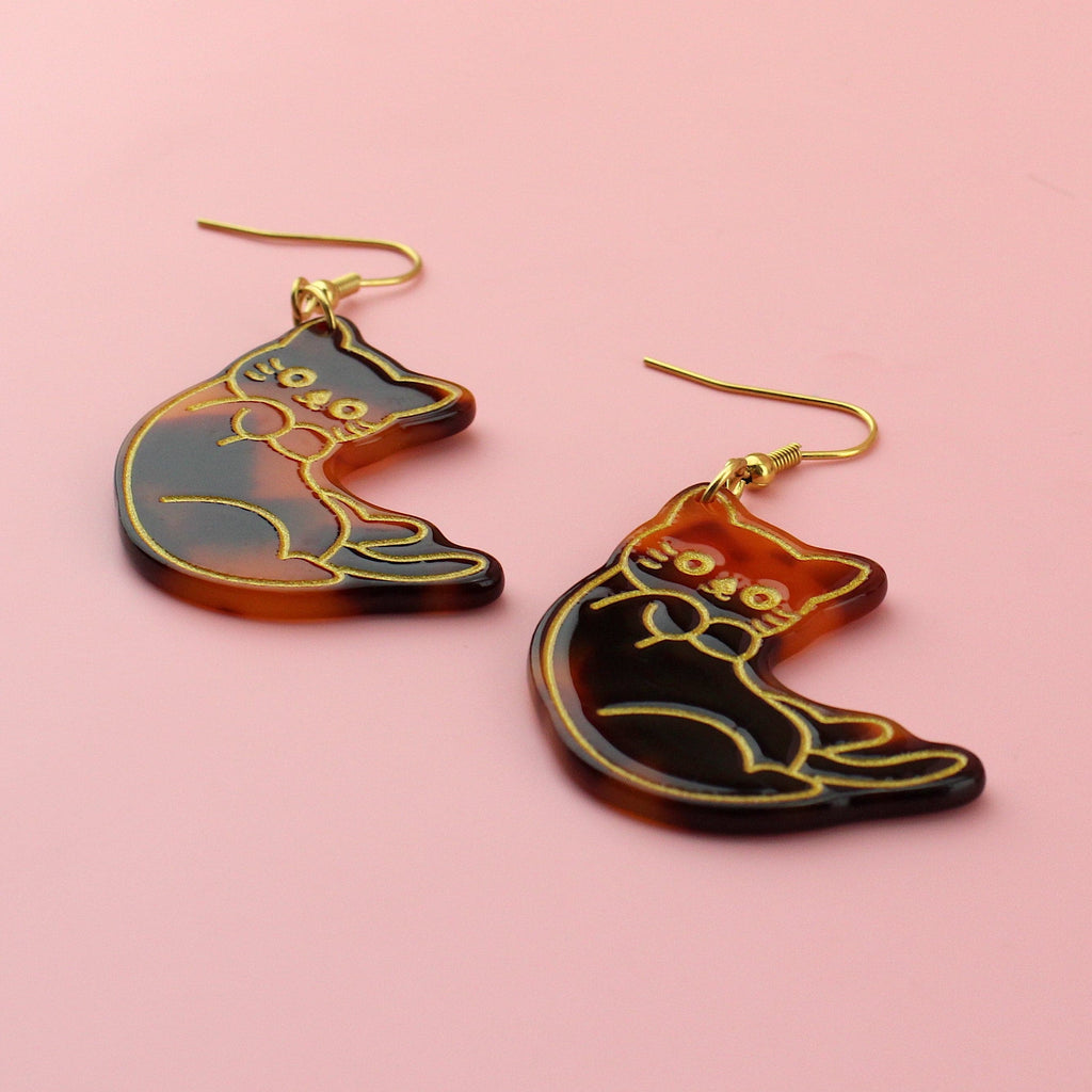 Resin tortoiseshell cat charms with a gold outline on gold plated stainless steel earwires