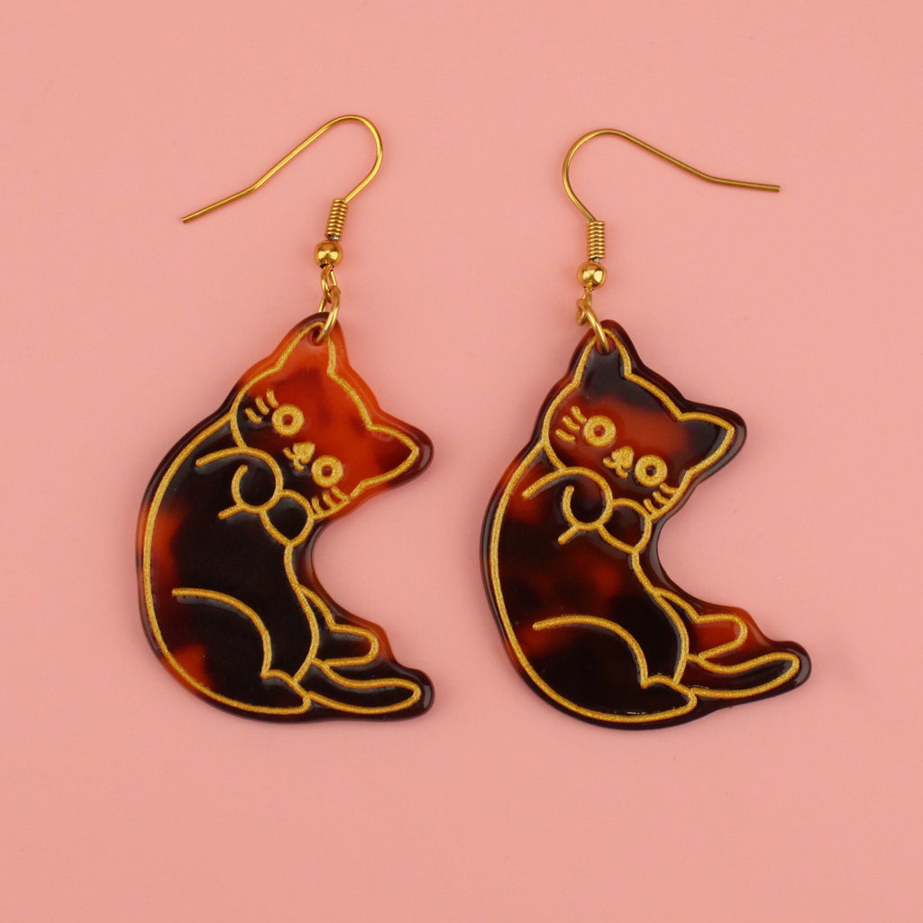 Resin tortoiseshell cat charms with a gold outline on gold plated stainless steel earwires
