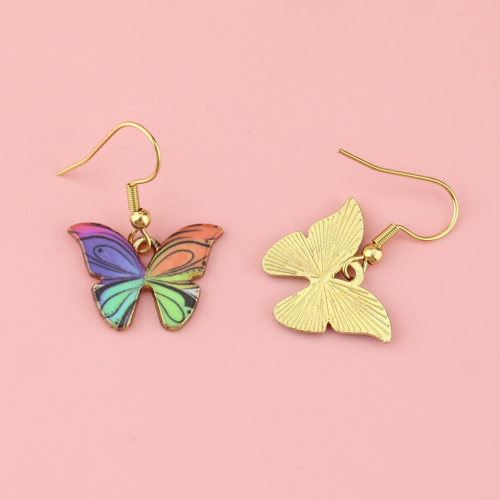 Gold plated rainbow butterfly-shaped charms on stainless steel earwires featuring hints of pink, purple,blue, red, orange and green