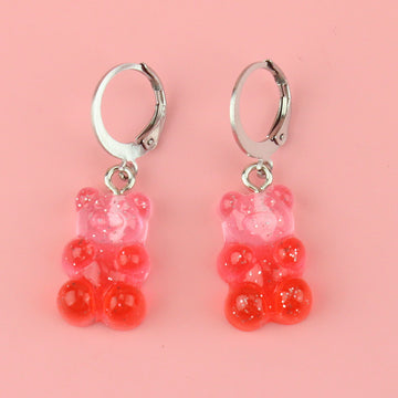 Pink and red glittery gummy bear charms on stainless steel huggie hoops