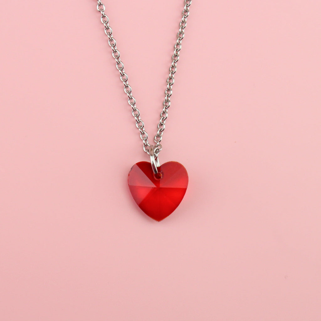 Stainless steel chain with red heart shaped pendant made of glass