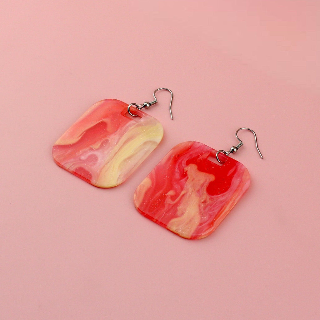 Red sparkling glittery marble resin charms on stainless steel earwires