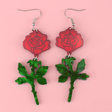red mirror acrylic roses and charming green acrylic thorn charms joined together hanging from stainless steel earwires