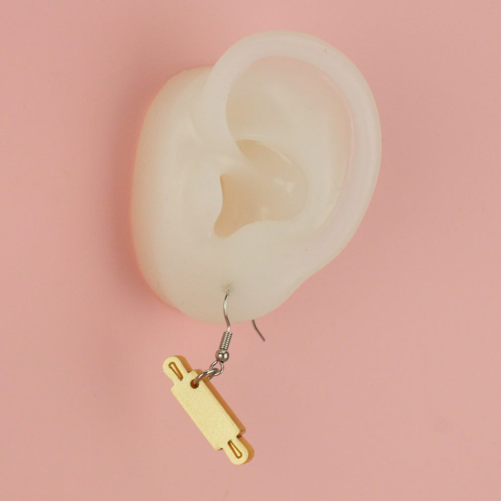 Ear wearing Rolling Pin Earrings