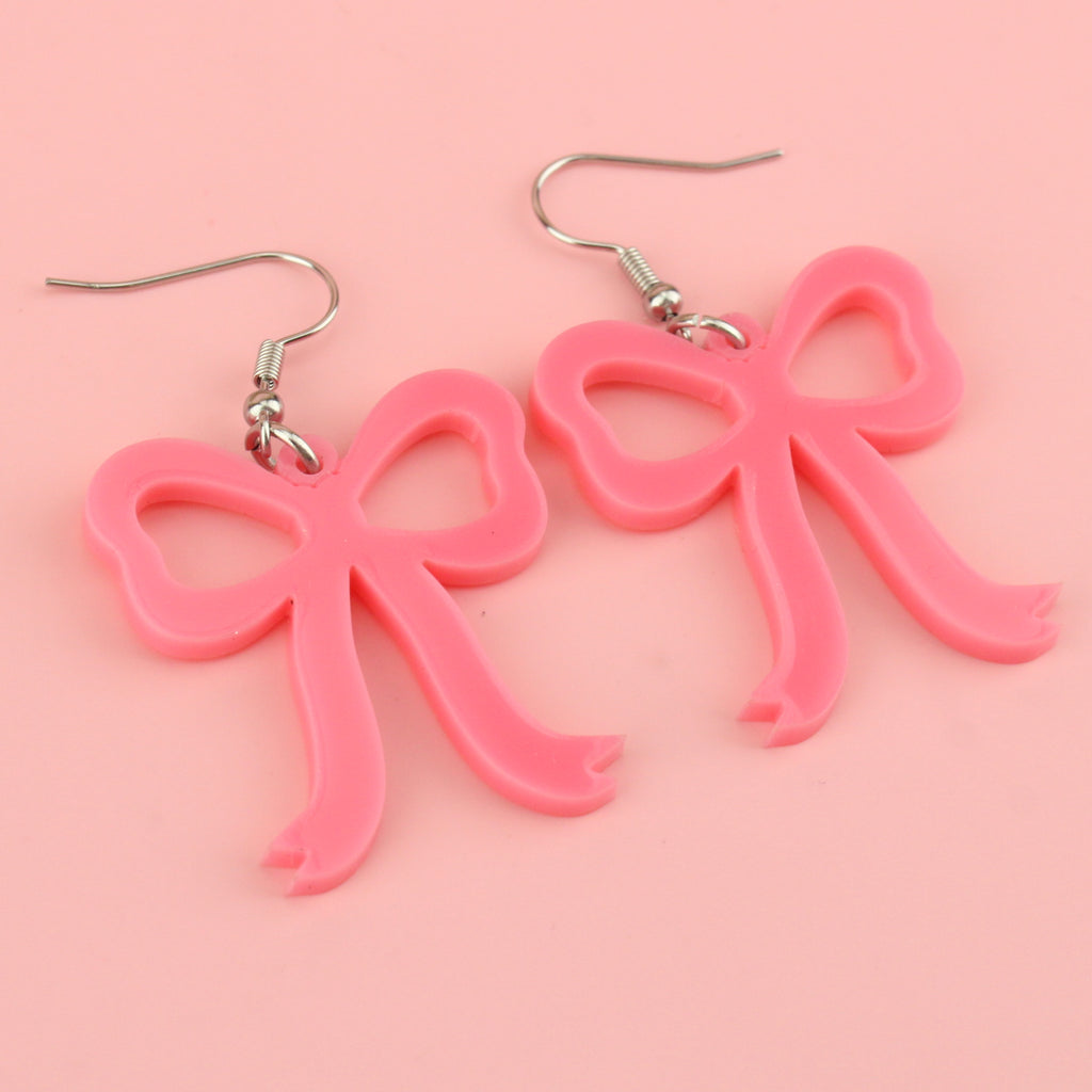 Rose pink bow shaped charms on stainless steel earwires