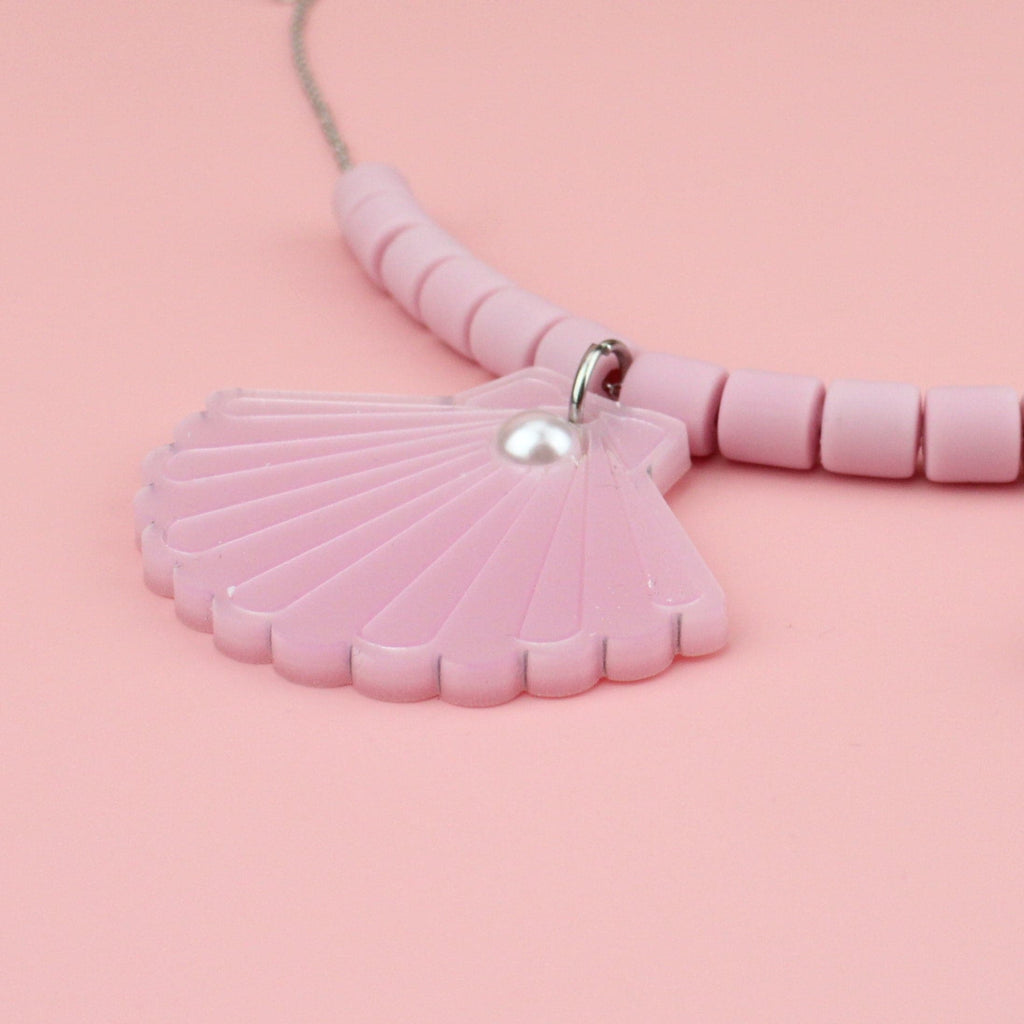 Close up of Pink Perspex Sea Shell Charms with Pink Clay Beads on a Stainless Steel Chain