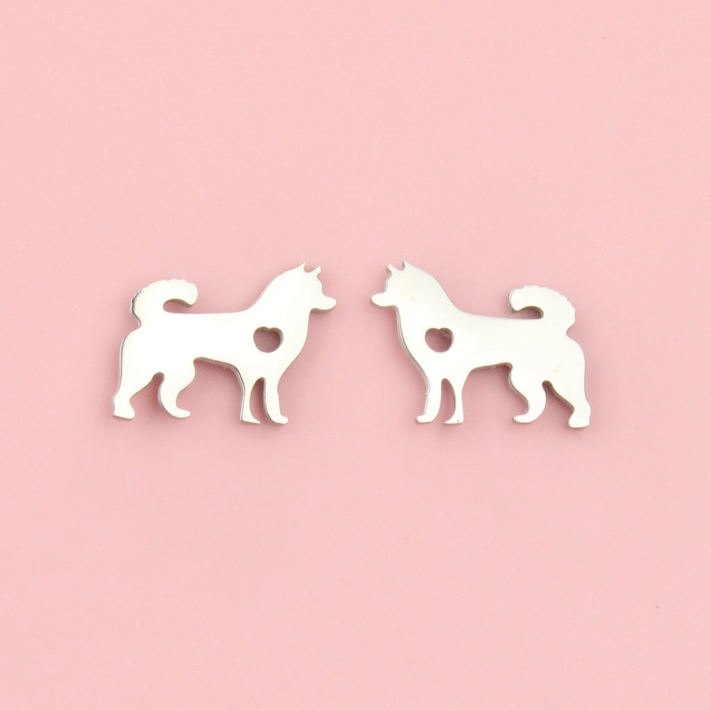 Stainless steel studs in the shape of a siberian husky with a cut out heart