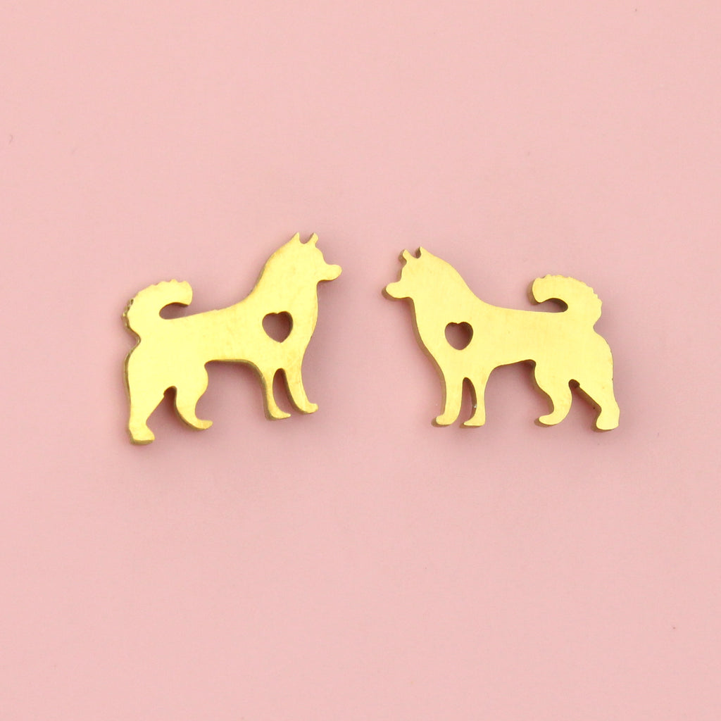 Gold plated stainlesss steel studs in the shape of a siberian husky with a cut out heart