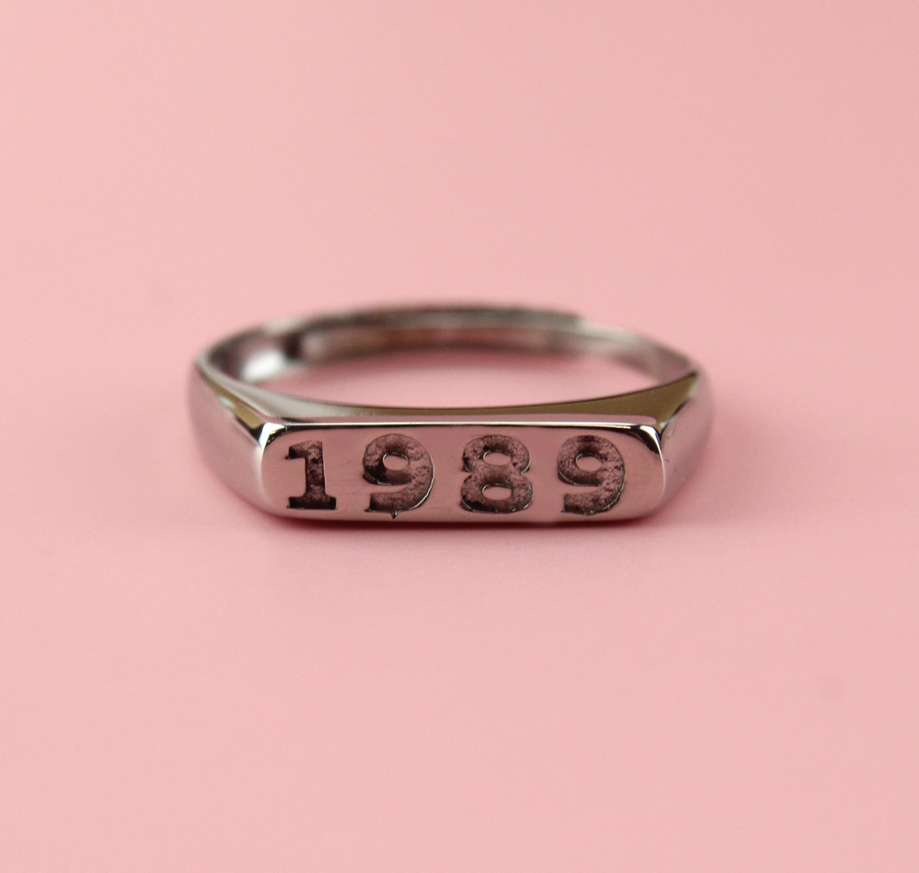 Stainless steel ring with 1989 engraved on the front