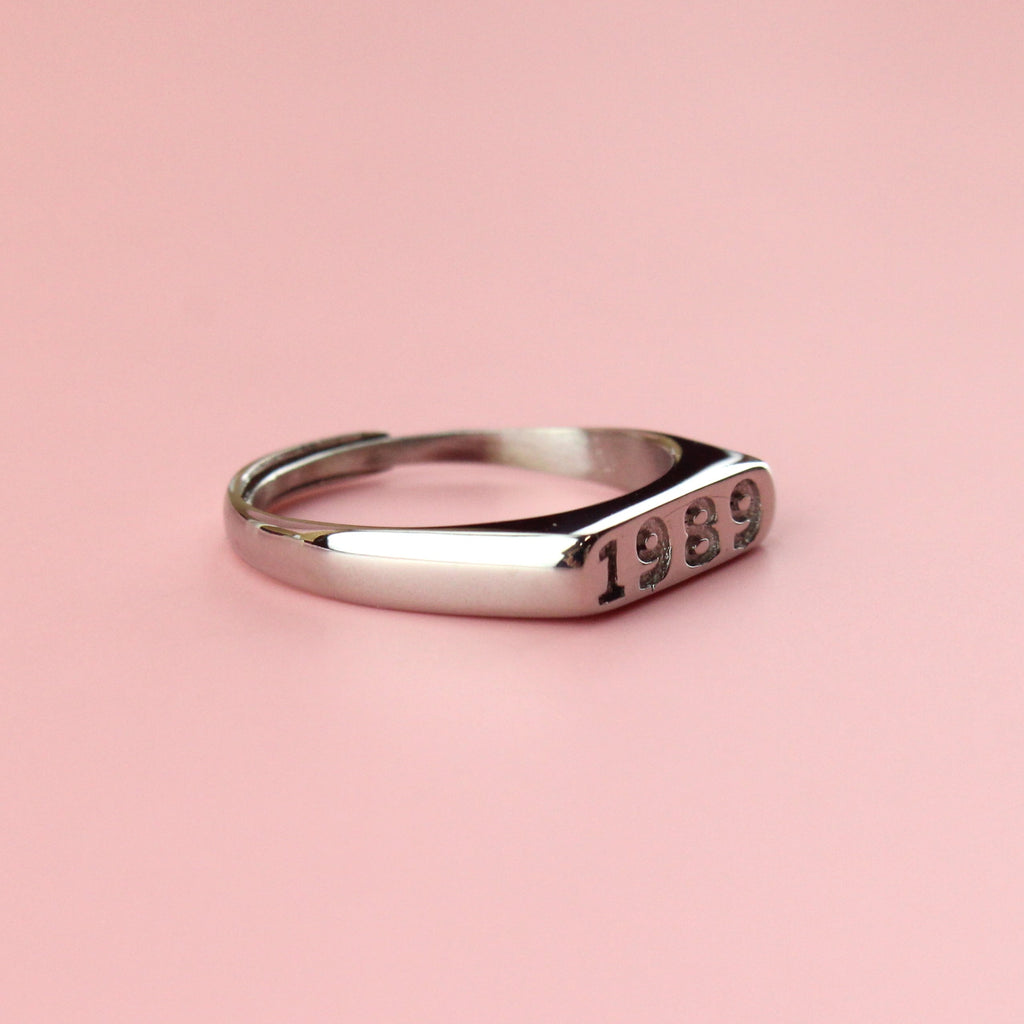 Stainless steel ring with 1989 engraved on the front