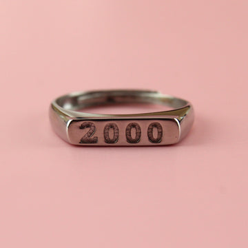 Stainless steel ring with 2000 engraved on the front