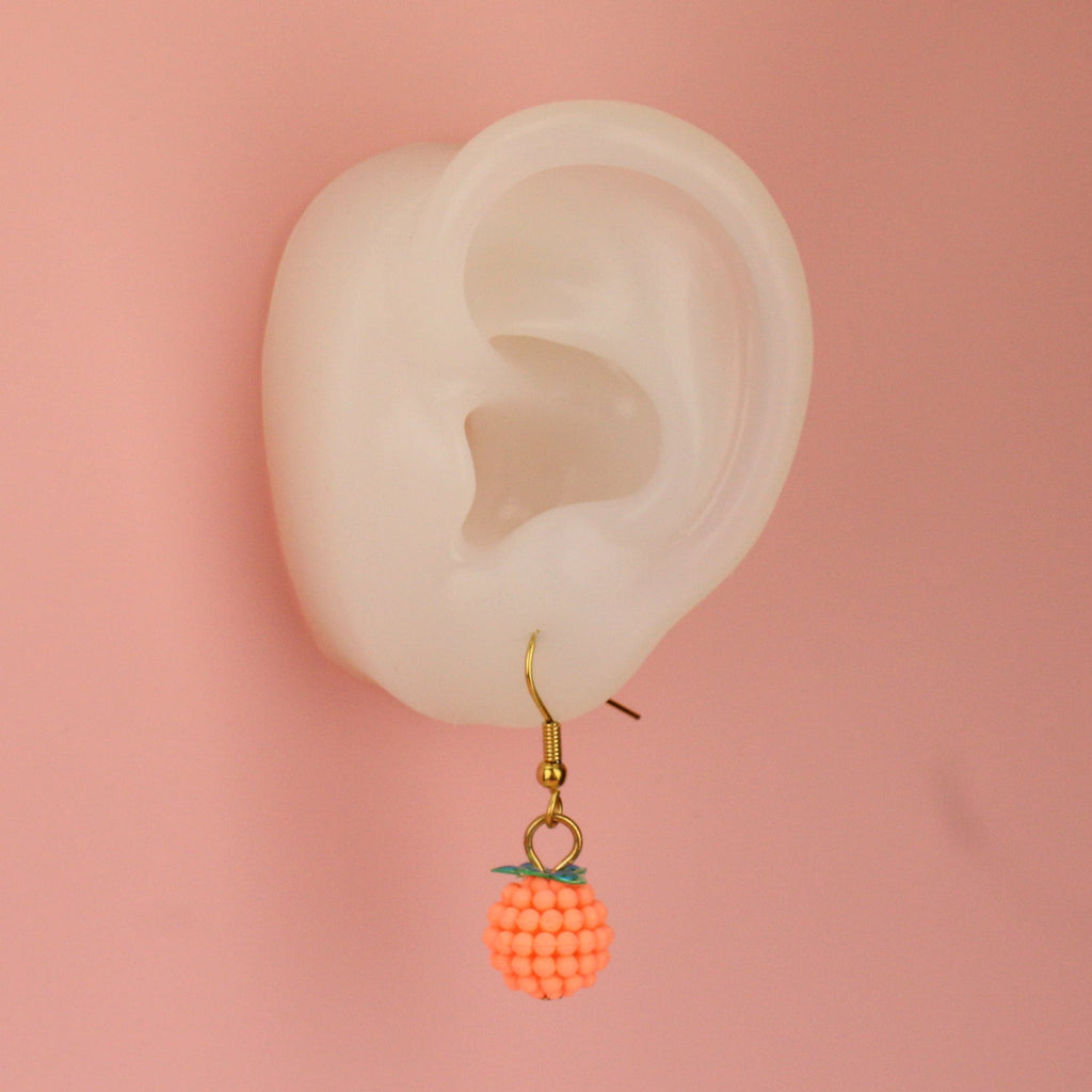 Ear wearing Stay Juicy Orange Earrings