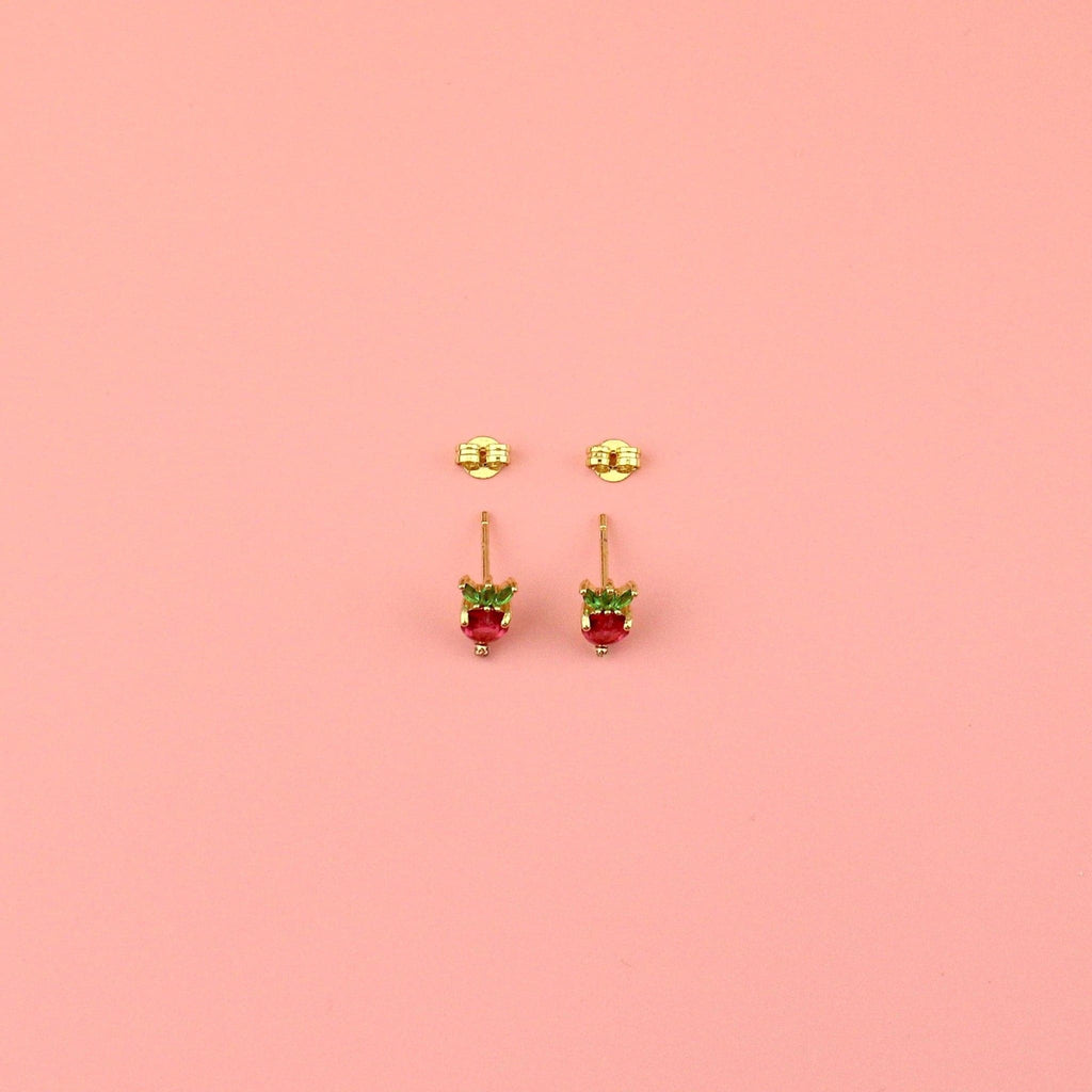Gold plated brass base stud earrings in the shape of a strawberry with red and green cubic zirconia stones with the backs of the studs
