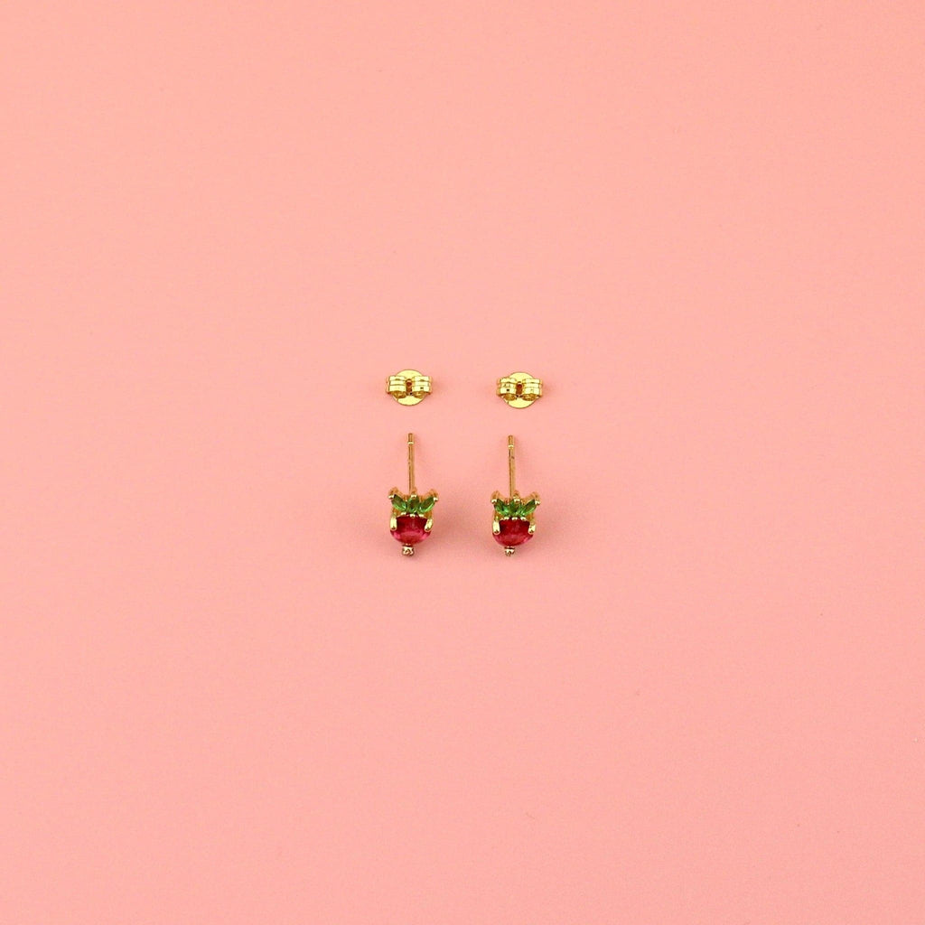 Gold plated brass base stud earrings in the shape of a strawberry with red and green cubic zirconia stones with the backs of the studs