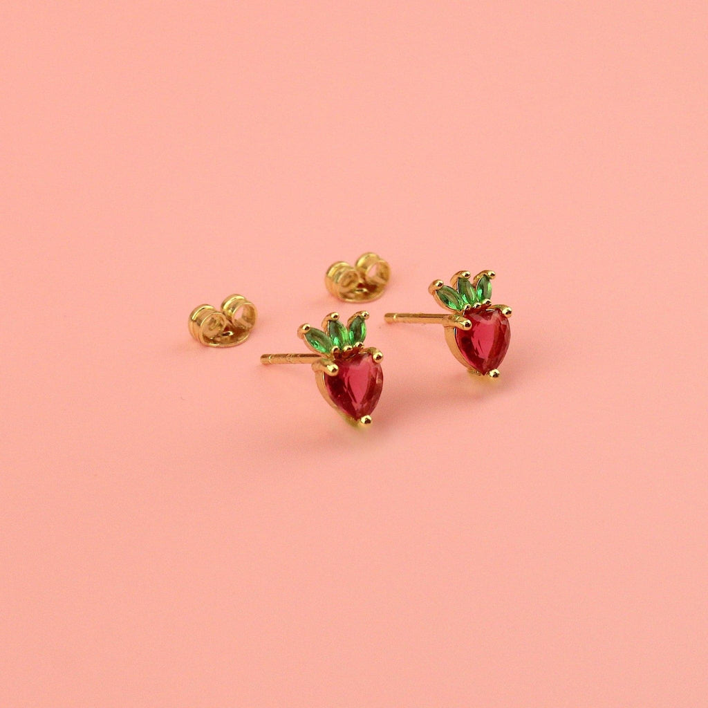 Gold plated brass base stud earrings in the shape of a strawberry with red and green cubic zirconia stones with the backs of the studs