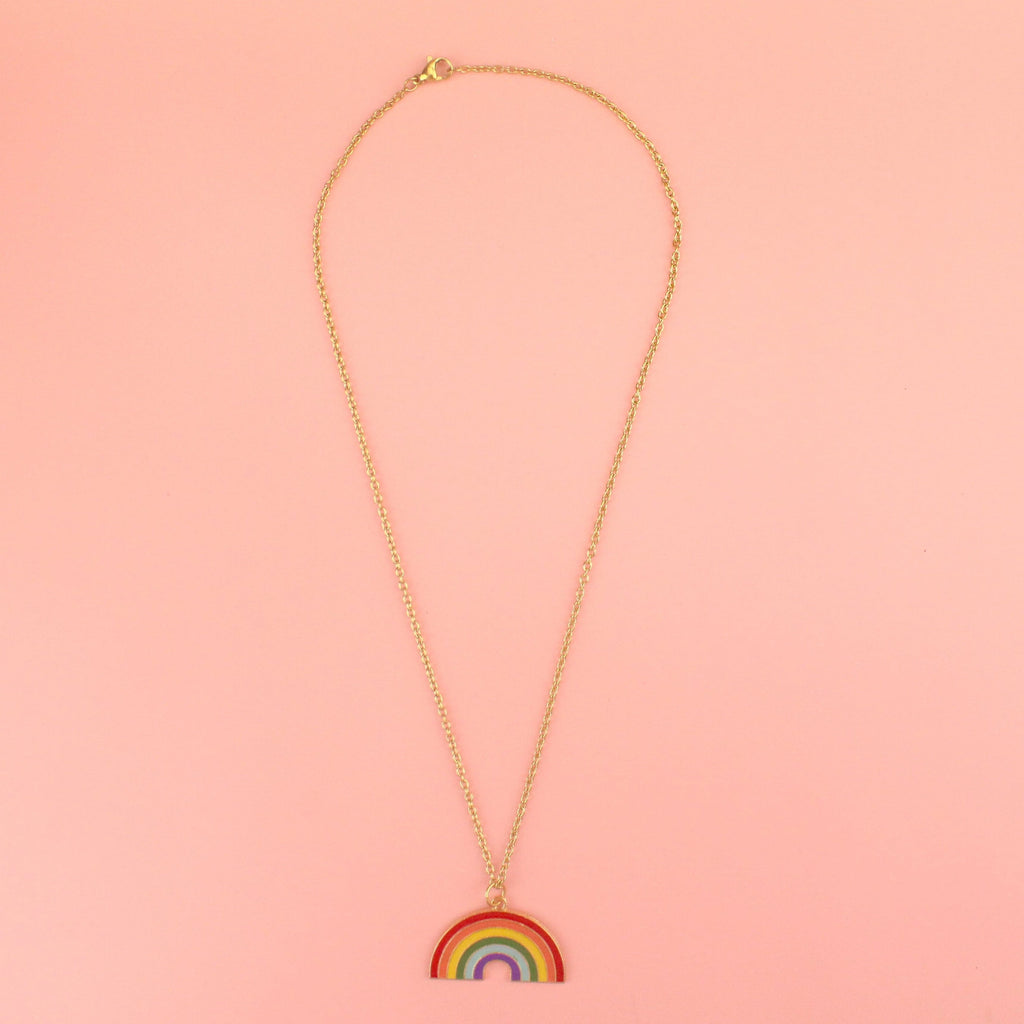 Gold plated base metal rainbow charm on a gold plated stainless steel necklace