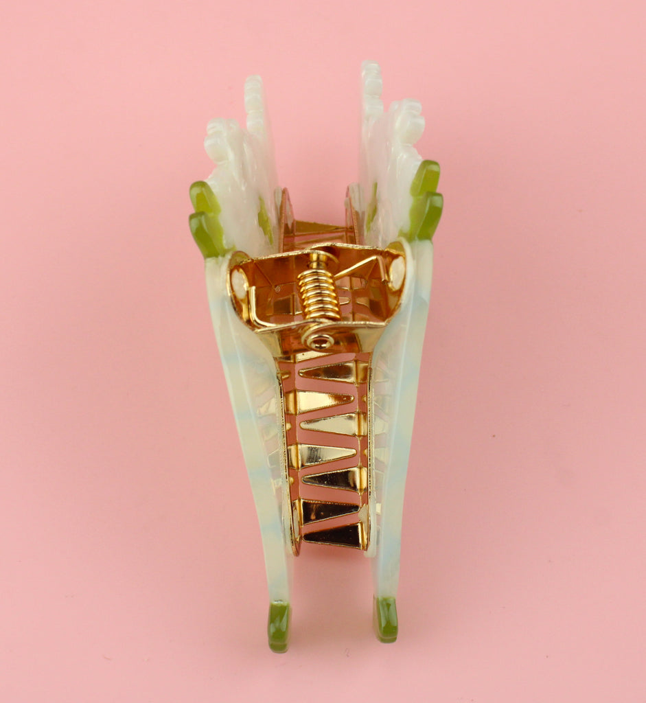 Acrylic claw clip in the shape of a white bouquet of flowers  - showing the inside of the clip